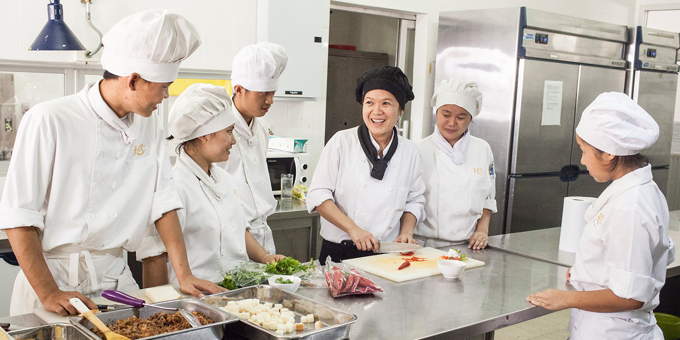 Young cook apprentices with their mentor in a hotel in Asia